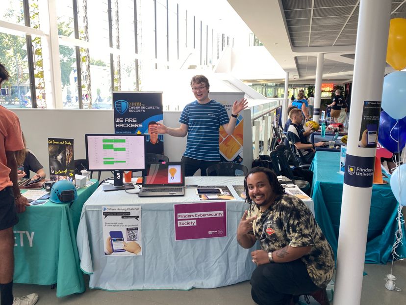 Cyber Society members Alistair and Aman running Oweek hacking stand